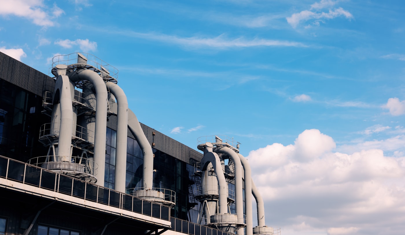 Large industrial complex with pipes, windows and production buildings